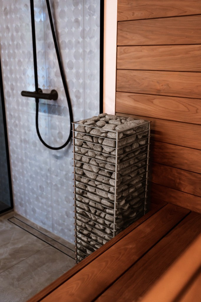 HUUM CLIFF heater beside sauna bench